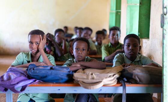 Students wait for lessons to get underway in a school in Sudan.